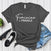 Feminine ≠ Fragile – Women’s Graphic Tee
