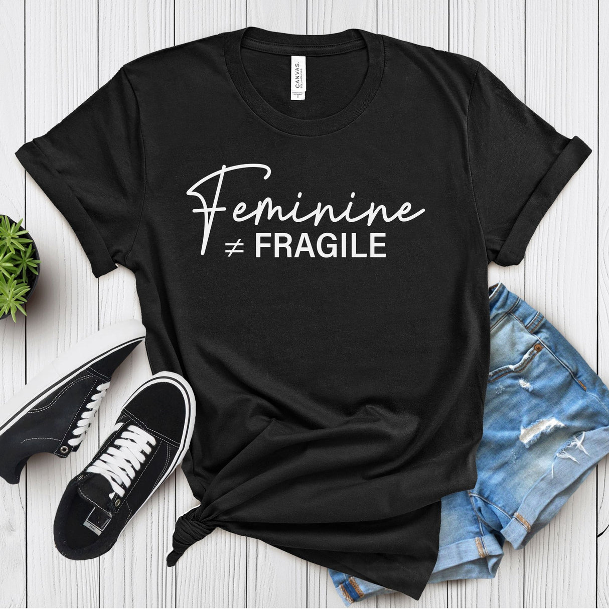 Feminine ≠ Fragile – Women’s Graphic Tee