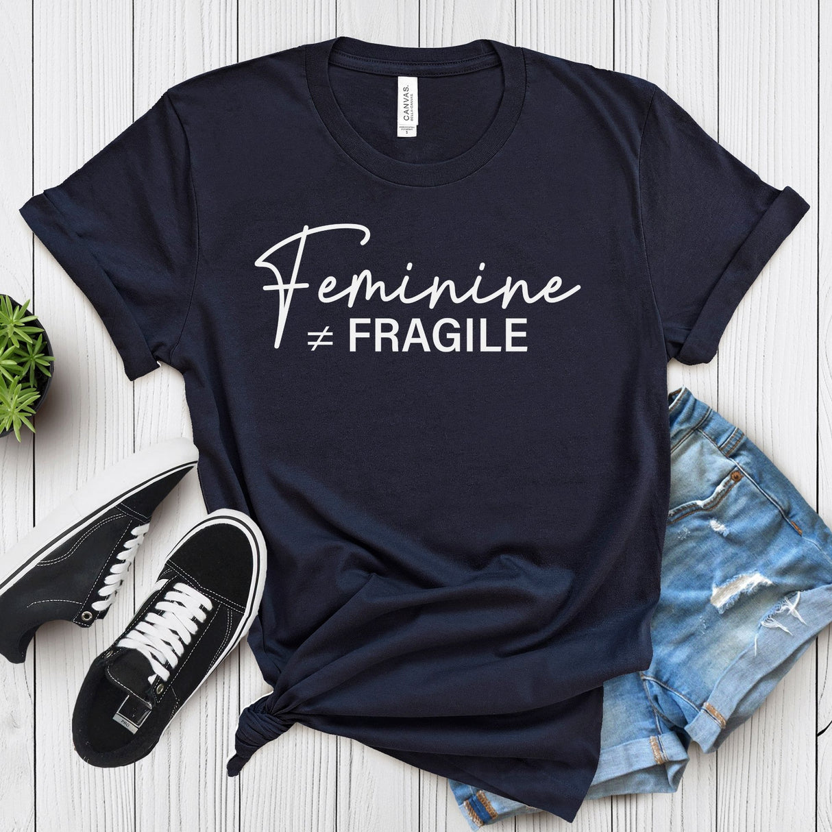 Feminine ≠ Fragile – Women’s Graphic Tee
