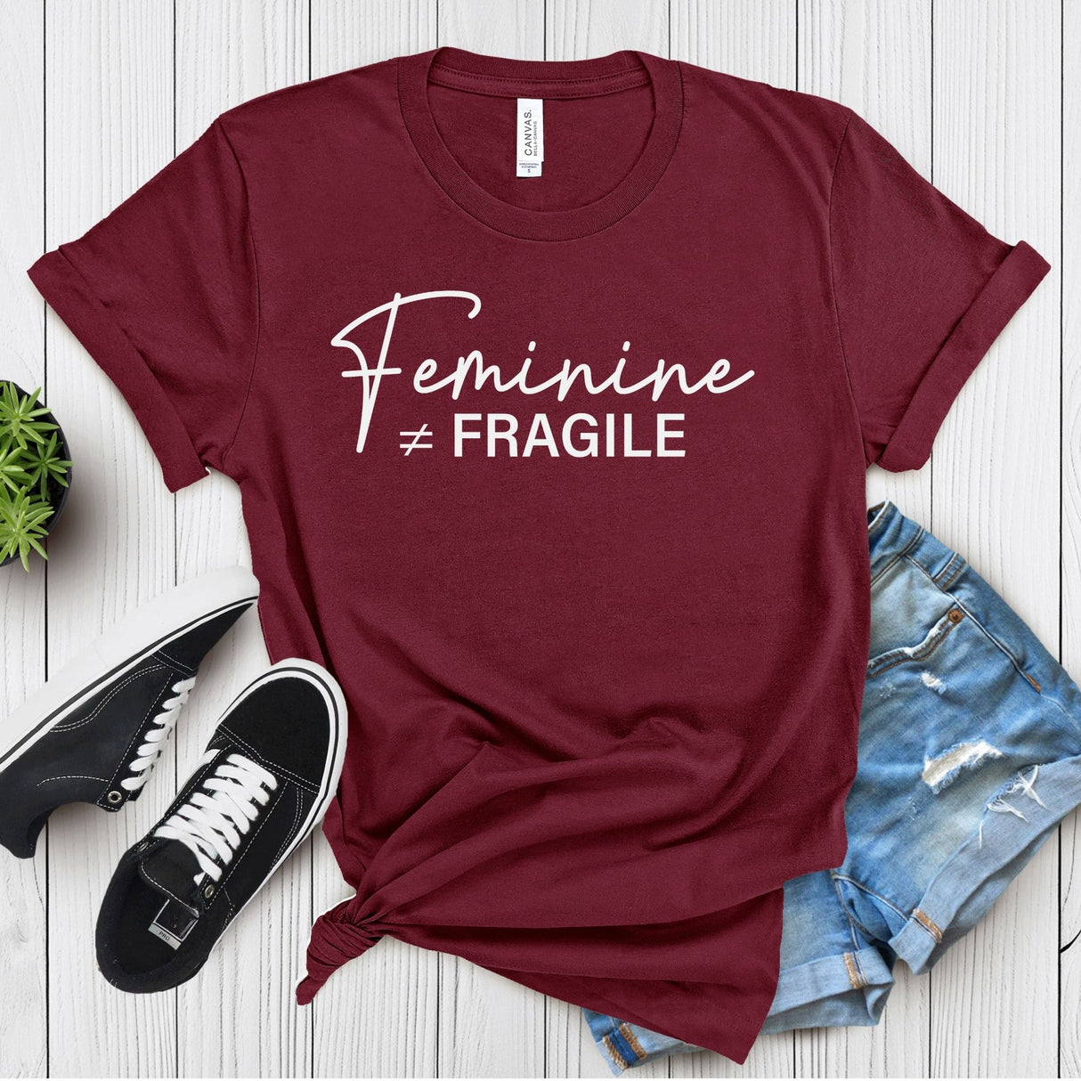 Feminine ≠ Fragile – Women’s Graphic Tee