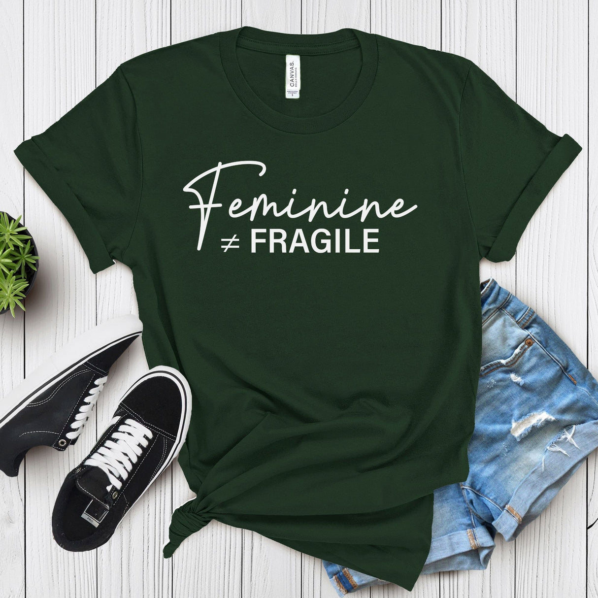 Feminine ≠ Fragile – Women’s Graphic Tee