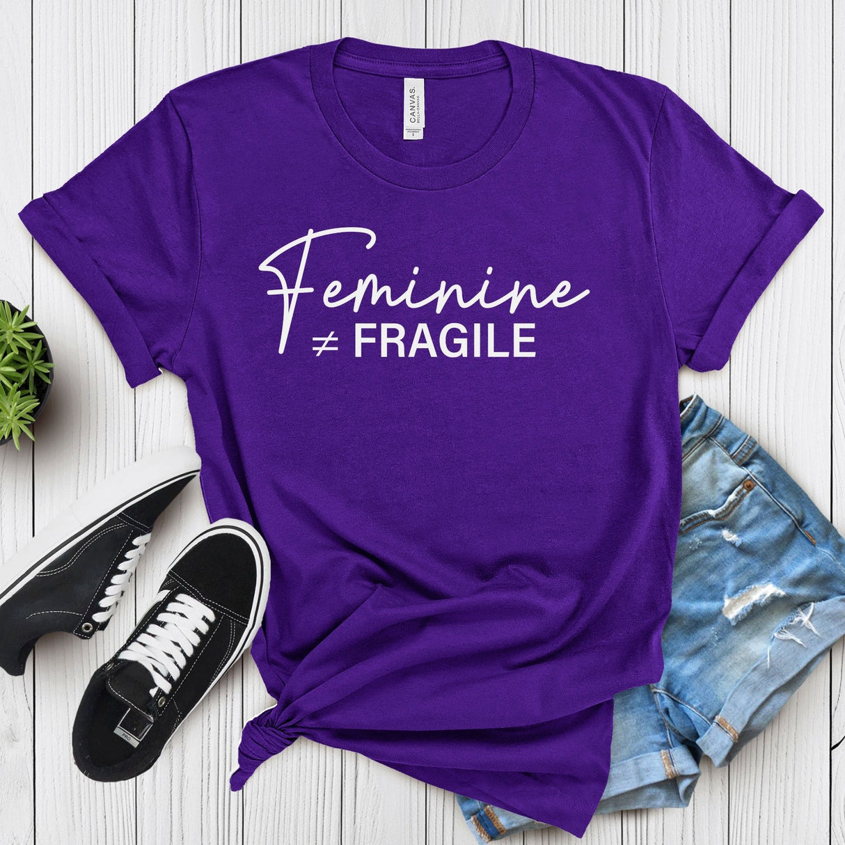 Feminine ≠ Fragile – Women’s Graphic Tee