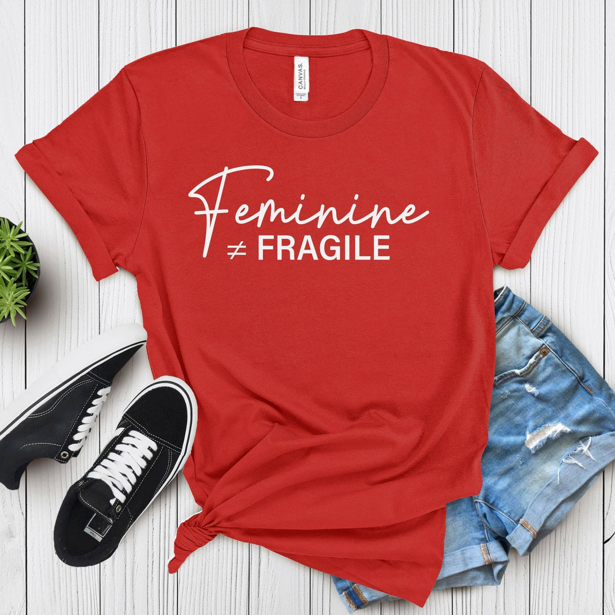 Feminine ≠ Fragile – Women’s Graphic Tee