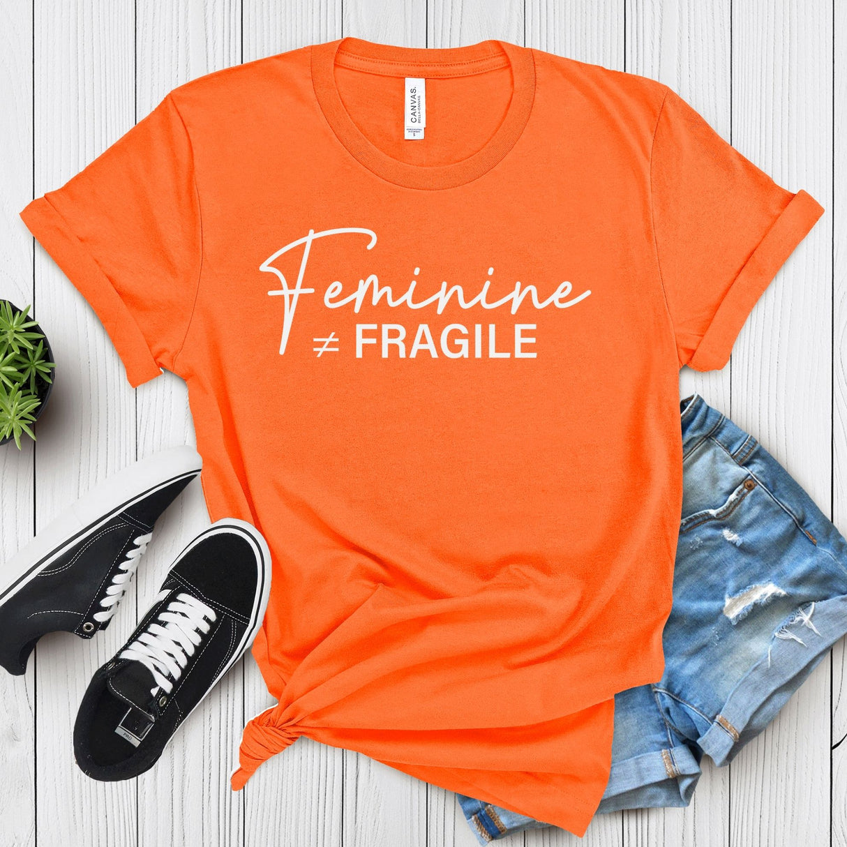 Feminine ≠ Fragile – Women’s Graphic Tee
