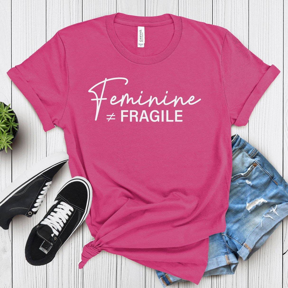 Feminine ≠ Fragile – Women’s Graphic Tee