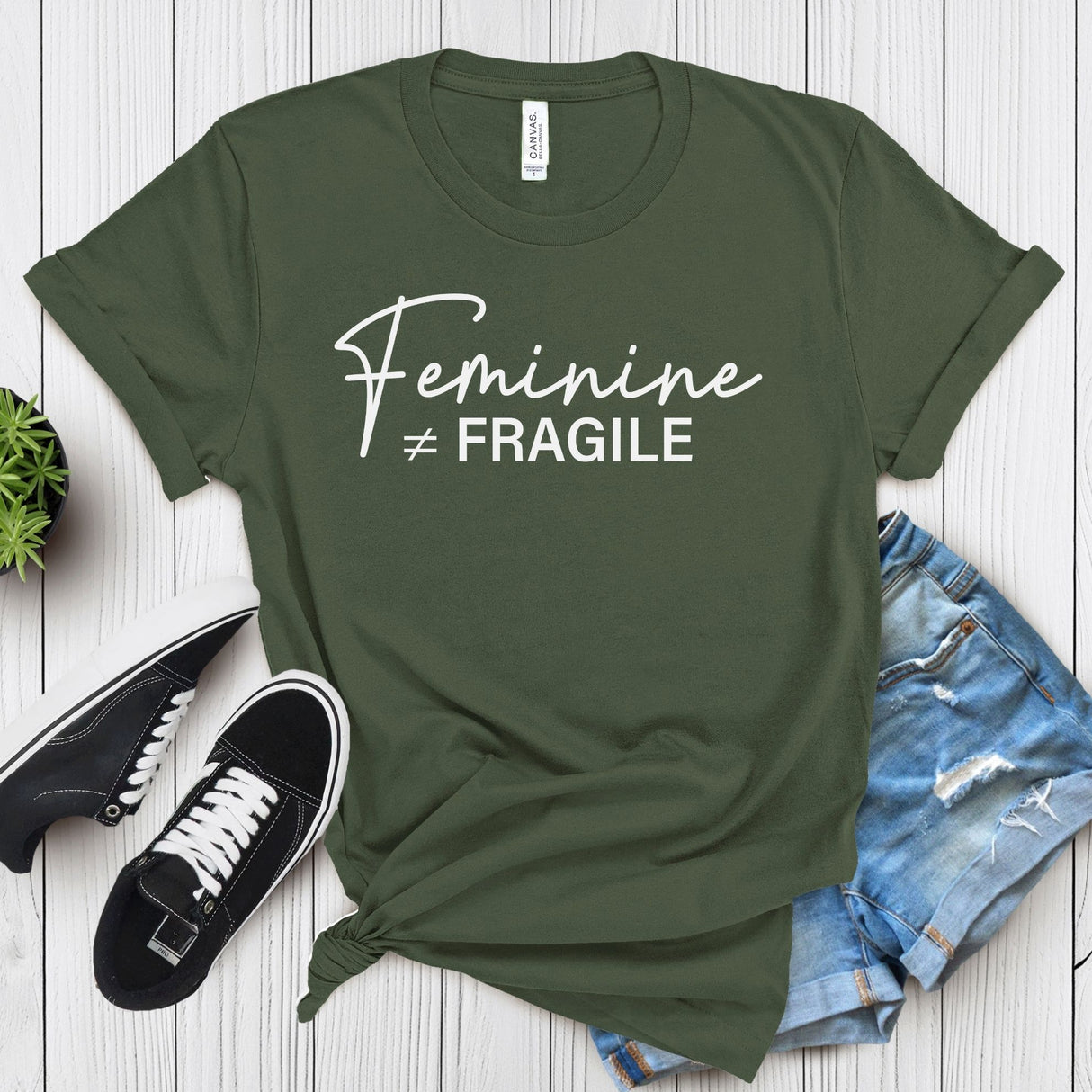 Feminine ≠ Fragile – Women’s Graphic Tee